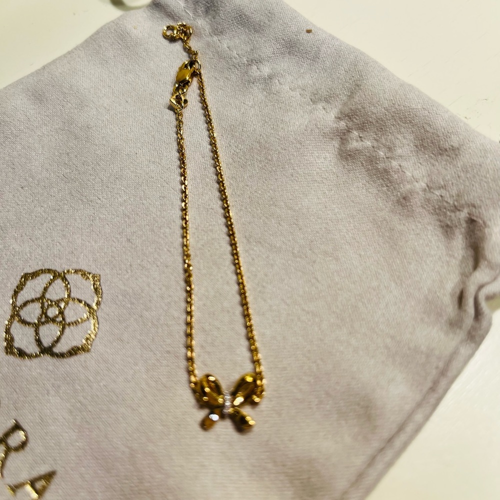 Authentic Kendra Scott “Sasha” gold tone bow bracelet with crystals